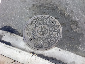 Old GTE manhole cover with different styling